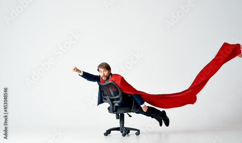 man superhero with red cloak office chair manager Professional