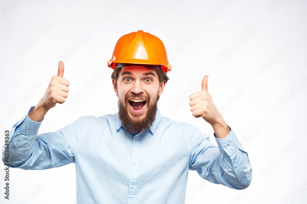 emotional man orange helmet on the head success isolated background