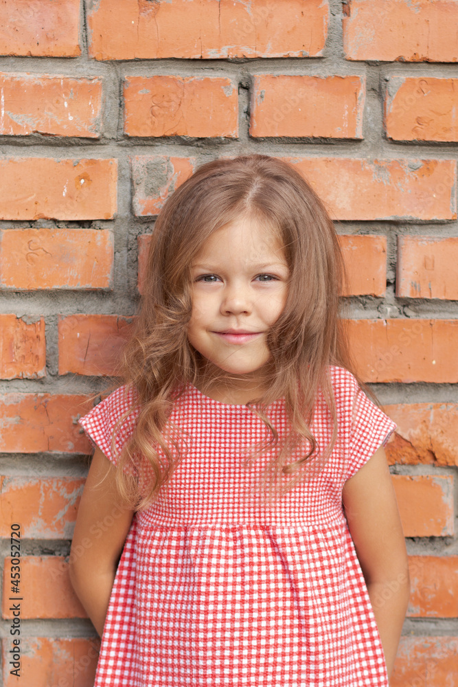 Smiling caucasian little girl of five years old looking at camera Smiling caucasian little girl of five years old looking at camera