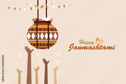 Hands reaching the butter in a decorated clay pot. Indian festival Janmashtami greeting background