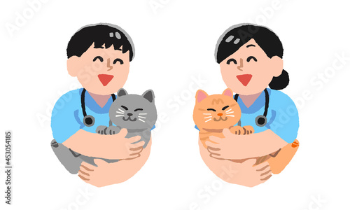 猫を抱っこする獣医師男女