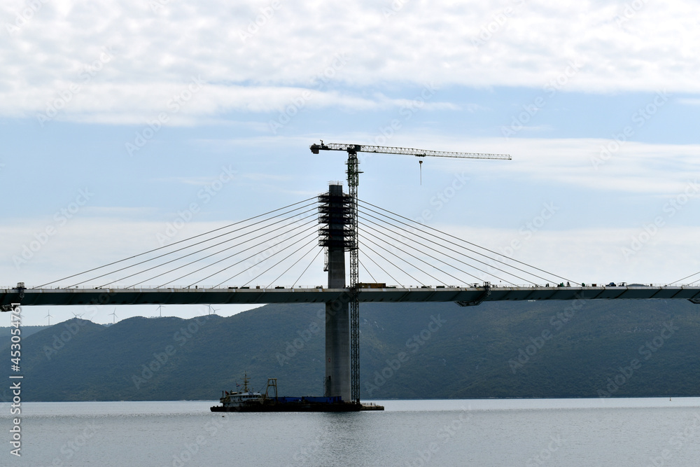 Obraz premium The Pelješac Bridge is a bridge in the Dubrovnik-Neretva County in Croatia that bridges the Mali Ston Bay between Komarna on the mainland and Brijesta on the Pelješac peninsula.