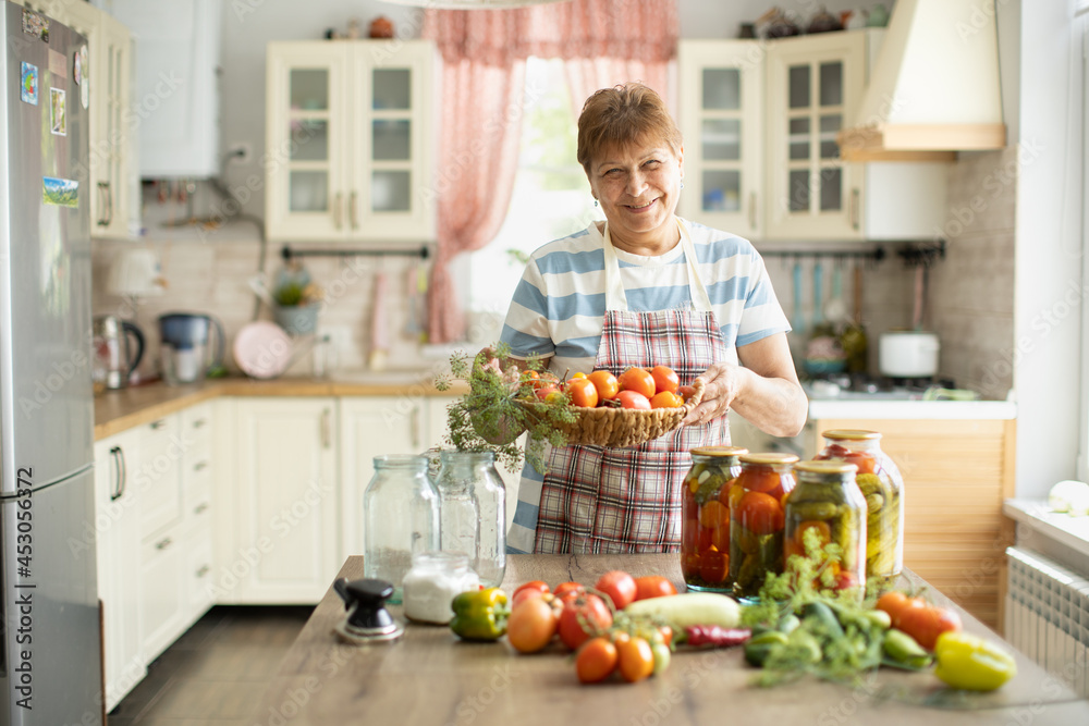 Woman in the kitchen makes pickles