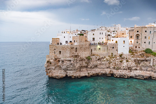Fototapeta Naklejka Na Ścianę i Meble -  Polignano a Mare. Town on the cliffs, Puglia region, Italy, Europe. Traveling concept background with old traditional houses, dramatic sky, Mediterranean Sea