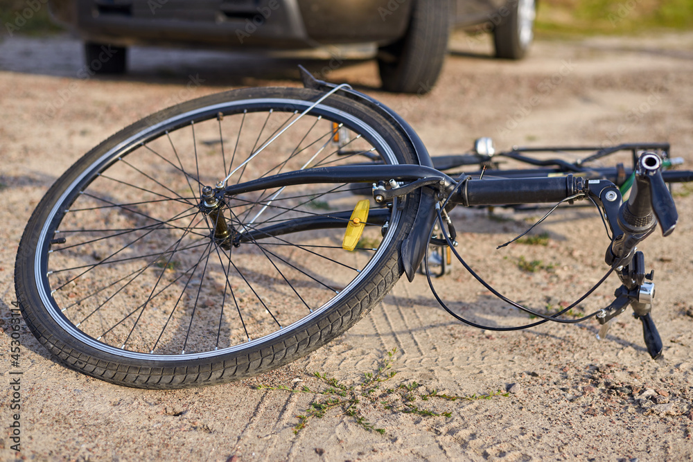 Photo of car and bicycle on the road. Photo of car and bicycle on the road.