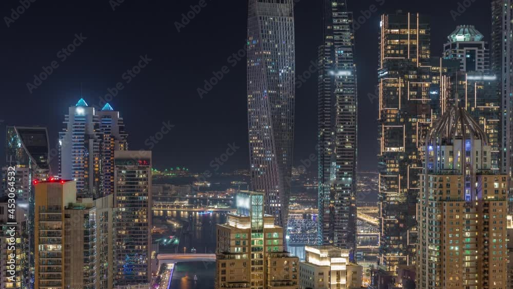 Skyscrapers of Dubai Marina near intersection on Sheikh Zayed Road with highest residential buildings night timelapse Skyscrapers of Dubai Marina near intersection on Sheikh Zayed Road with highest residential buildings night timelapse