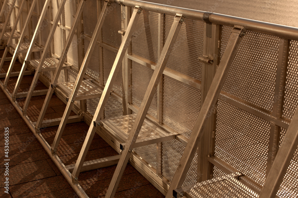 Obraz premium metal fence in the forest. modern metal fencing Metal fence. Fencing around the territory. Close-up of a fence.