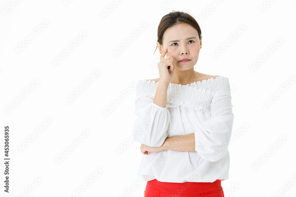 Isolated portrait studio shot of Asian doubtful thoughtful businesswoman in long sleeve shirt and red skirt standing thinking holding finger touch face in front of white background with copy space Isolated portrait studio shot of Asian doubtful thoughtful businesswoman in long sleeve shirt and red skirt standing thinking holding finger touch face in front of white background with copy space