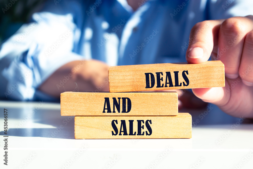 Deals and sales - phrase words from wooden blocks with letters, black Friday best sales and deals happening today concept Deals and sales - phrase words from wooden blocks with letters, black Friday best sales and deals happening today concept