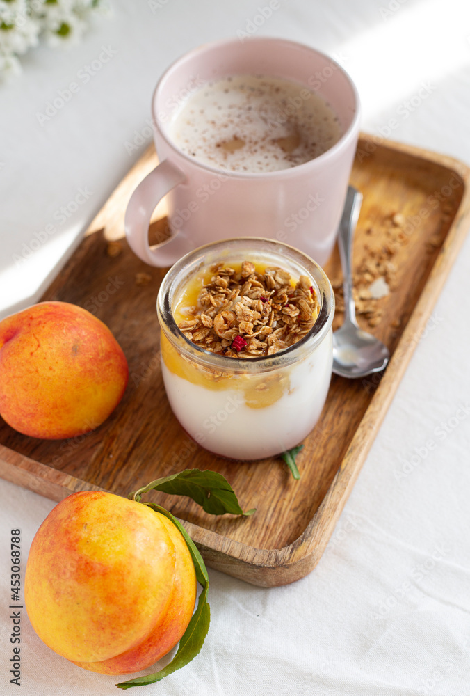 breakfast in bed with yoghurt, cappuccino and fruit breakfast in bed with yoghurt, cappuccino and fruit