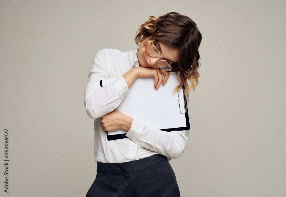 woman in white shirt documents folder in hand professional work woman in white shirt documents folder in hand professional work