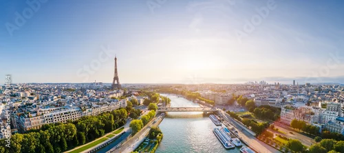 Panel kuchenny z motywem Paris aerial panorama with river Seine and Eiffel tower, France. Romantic summer holidays vacation destination. Panoramic view above historical Parisian buildings and landmarks with blue sky and sun
