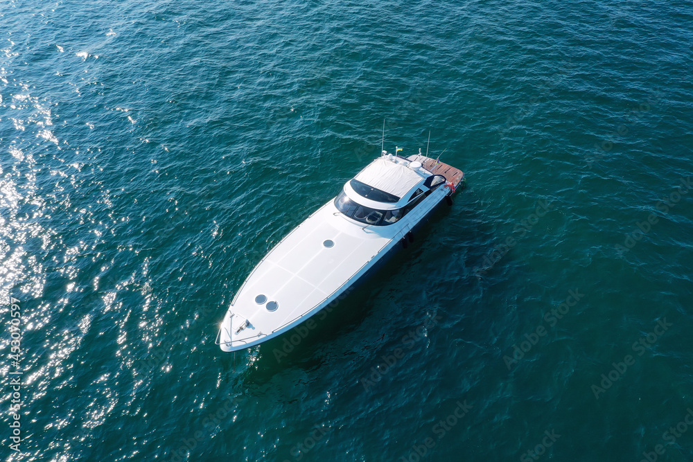 Luxury yacht among the sea. View from above. Shooting from a drone. 