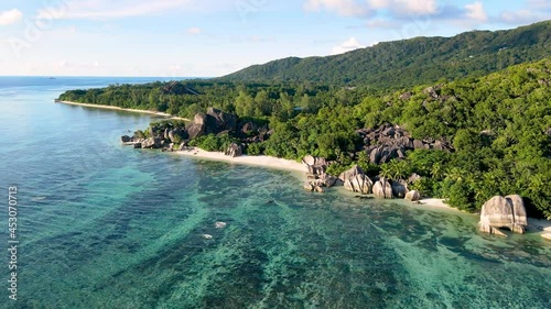 Beach Anse Source d'Argent in La Digue island, Seychelles. Aerial drone video footage 4k 60fps. Paradise holiday vacation destination, scenic landscape with turquoise sea water and white sand