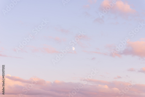 Purple and Pink Sky,moon and beautiful clouds with colored background.