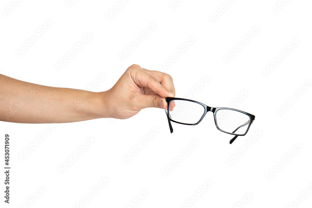 Close up of hand holding eyeglasses isolated with white background Close up of hand holding eyeglasses isolated with white background