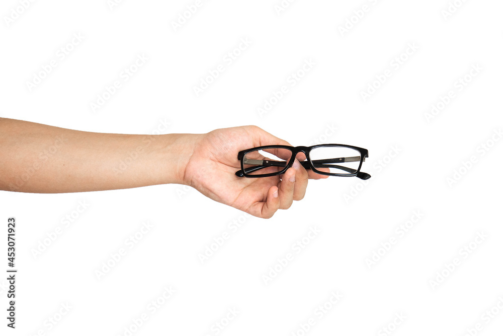 Close up of hand holding eyeglasses isolated with white background Close up of hand holding eyeglasses isolated with white background