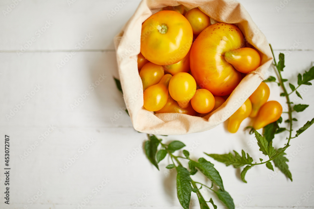 Market delivary of yellow tomatoes in eco textile bag, Zero waste Market delivary of yellow tomatoes in eco textile bag, Zero waste