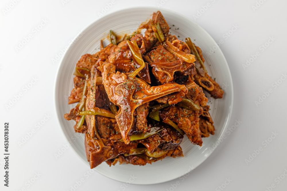 Steamed pork backbone on a white background