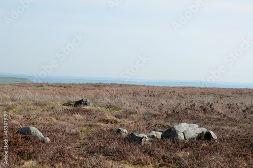 pennine landscape with large old boulders and stones on midgley moor in west yorkshire photo