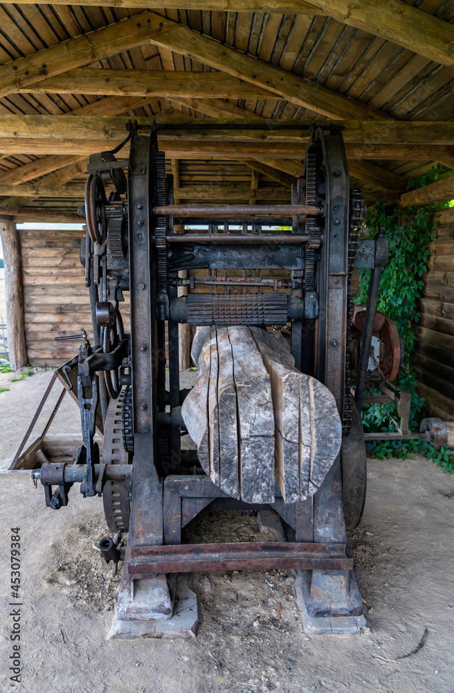 view of a historic wood saw and mill for cutting logs