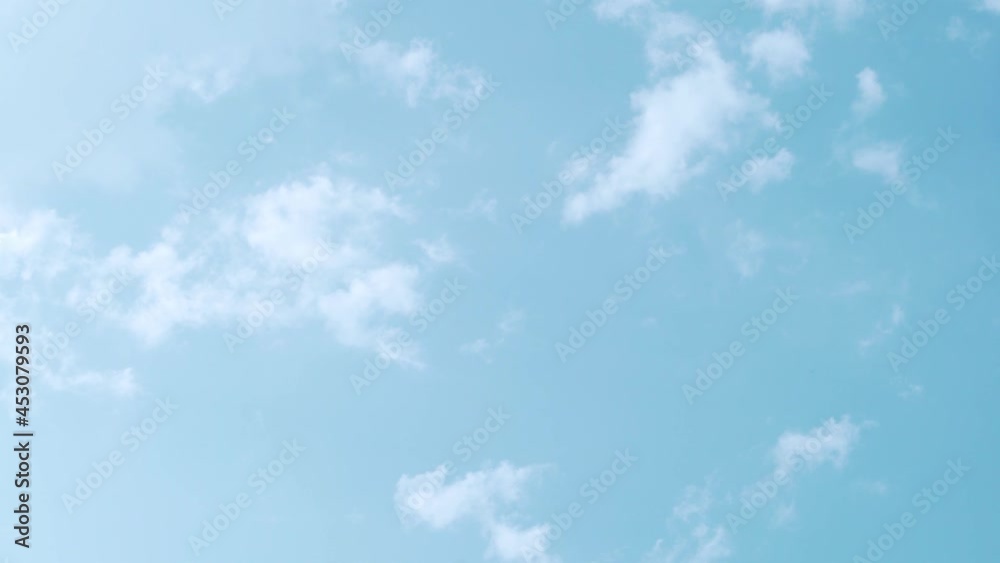 Timelapse of White Clouds in a Clear Blue Sky. Natural Background of Clear Sky and White Clouds. Atmosphere, Serene Blue Sky, Air, Altitude, Azon Layer. Timelapse of White Clouds in a Clear Blue Sky. Natural Background of Clear Sky and White Clouds. Atmosphere, Serene Blue Sky, Air, Altitude, Azon Layer.