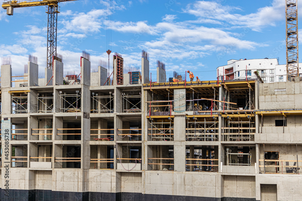 Construction of a monolithic reinforced concrete house. Modern building technologies. Construction of a modern multi-storey building.