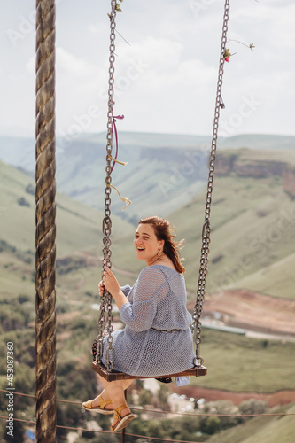 Young woman on a swing
