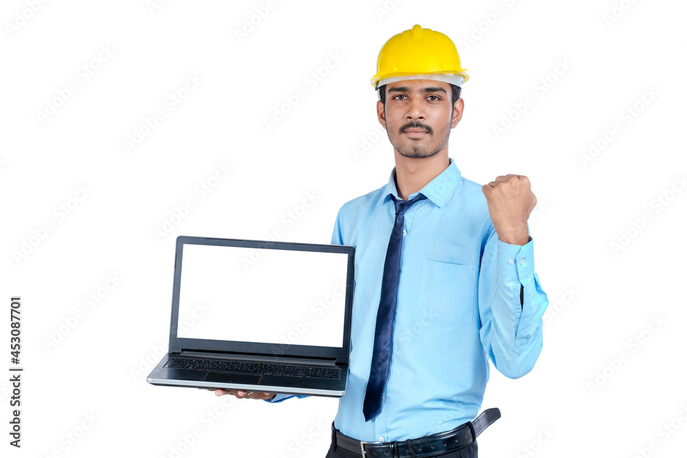 Indian engineer showing laptop empty screen on white background. Indian engineer showing laptop empty screen on white background.