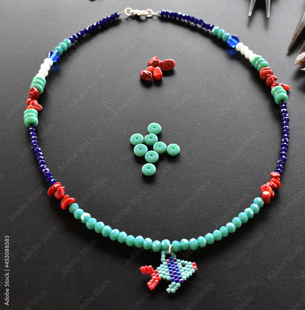 A multicolor necklace on a black background
A multicolor necklace on a black background