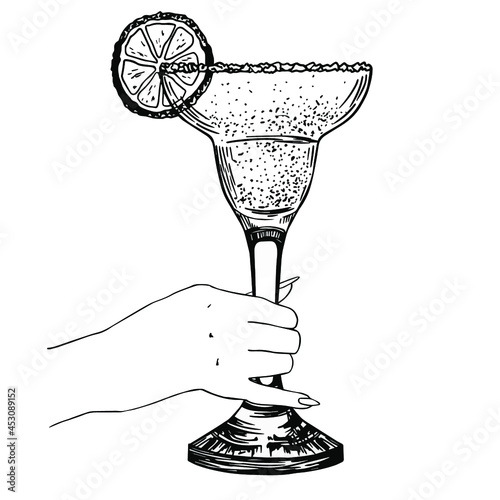 Glass of margarita in woman hand. Hand drawn sketch, engraving. Stock vector illustration.