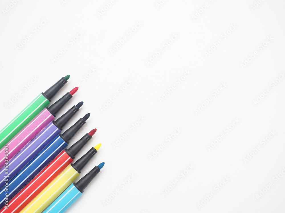 Close up color pen different array on white isolated top view copy space Close up color pen different array on white isolated top view copy space
