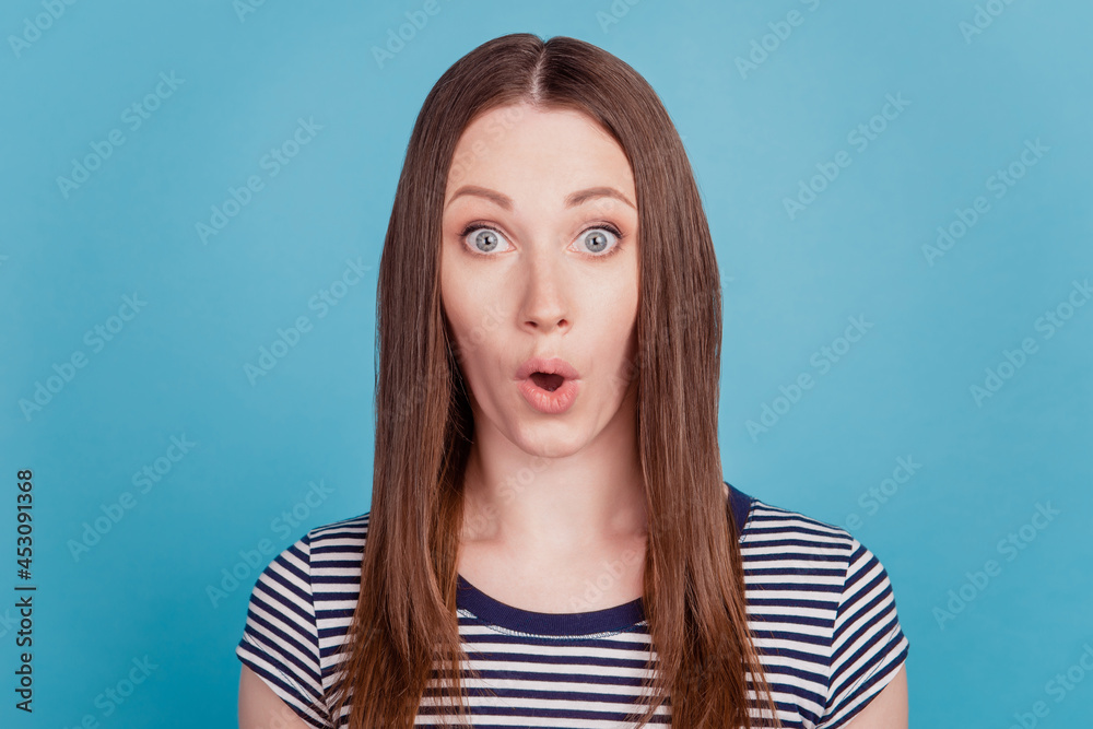 Portrait of shocked funky positive lady wow reaction open mouth on blue background Portrait of shocked funky positive lady wow reaction open mouth on blue background