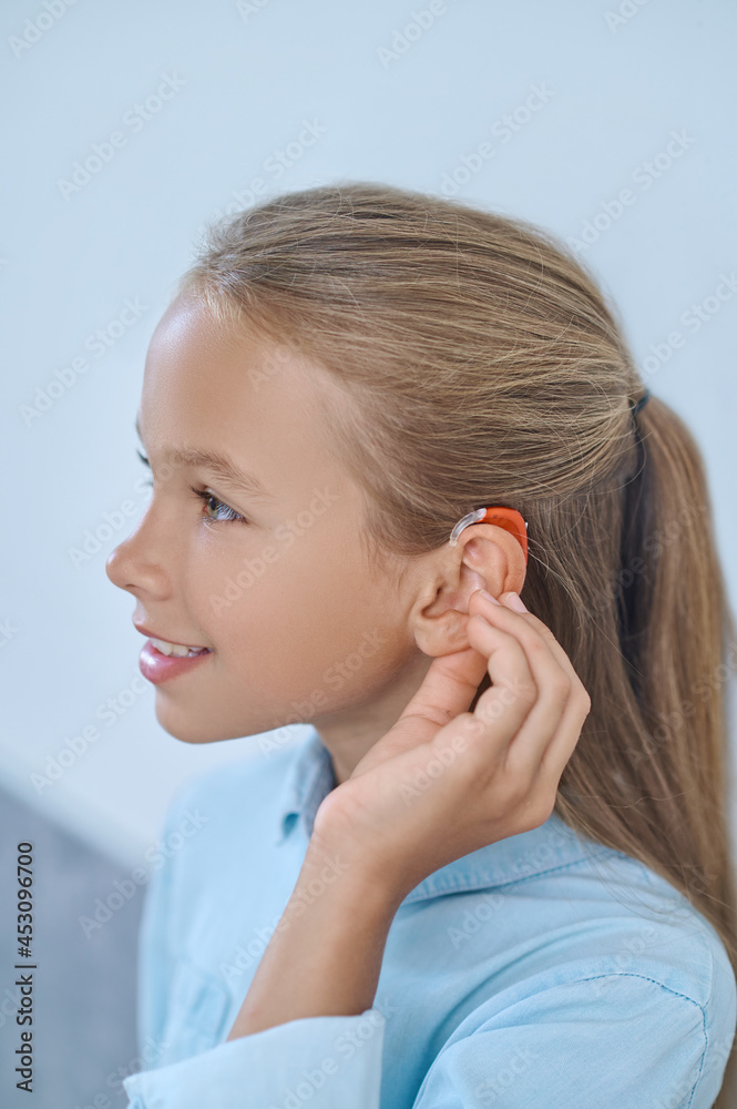 Girl with beautiful appearance in stylish hearing aid Girl with beautiful appearance in stylish hearing aid