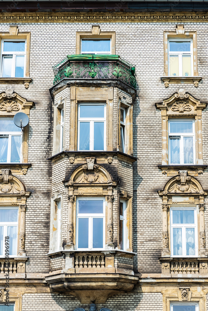 Facade of an old classic building in Krakow, Poland