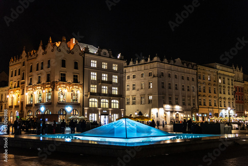 Crystal fountain at night in Krakow, Poland