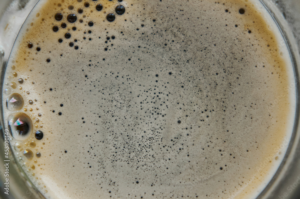 Black coffee foam top view Black coffee foam top view