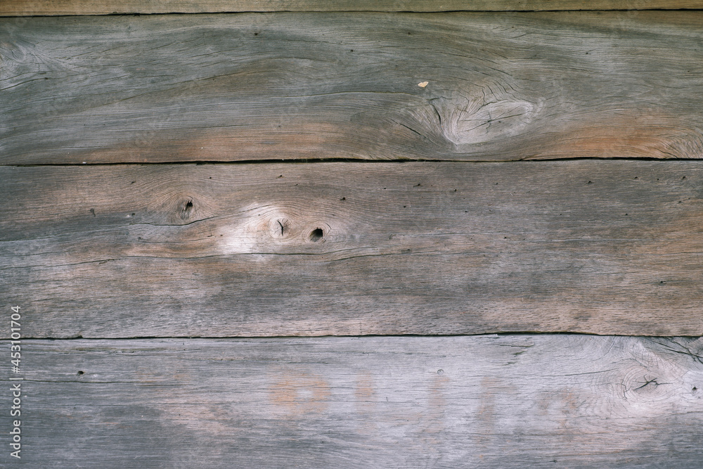 Naklejka premium Wood texture, background. The surface of an old wooden slab house. Old slab texture. Abstract wood background, empty template Old Vintage Planked