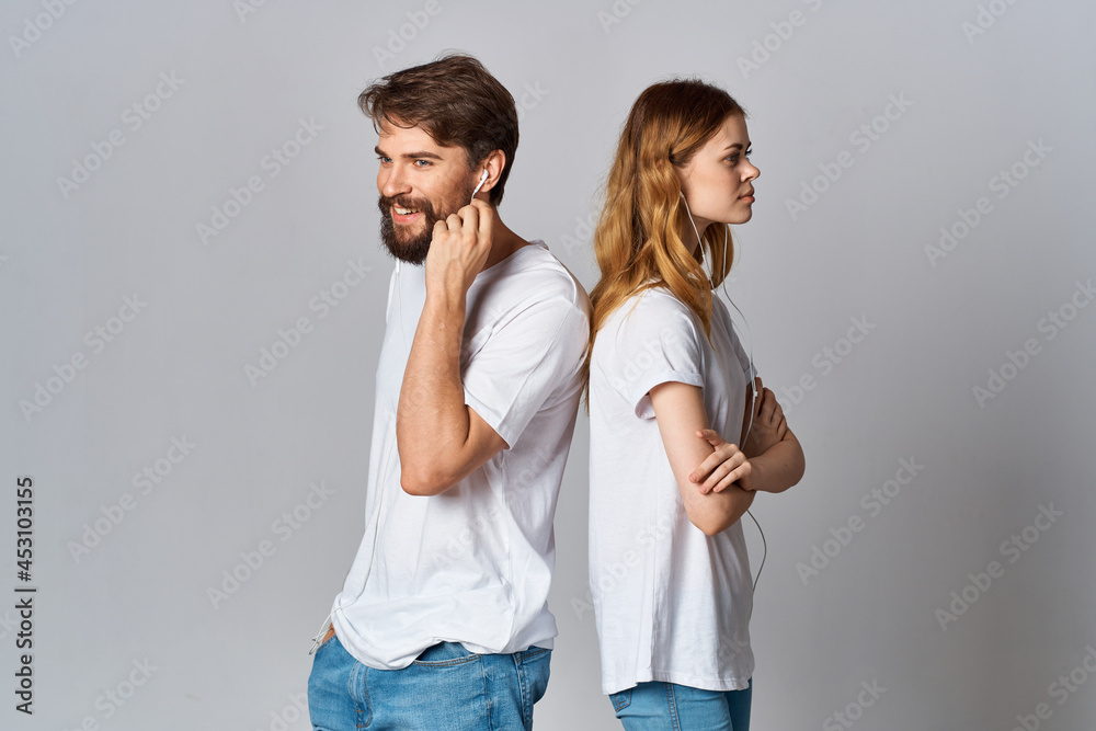 young couple white t-shirts next to lifestyle listening music friendship young couple white t-shirts next to lifestyle listening music friendship