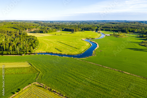 Aerial view of cultivated field and small river