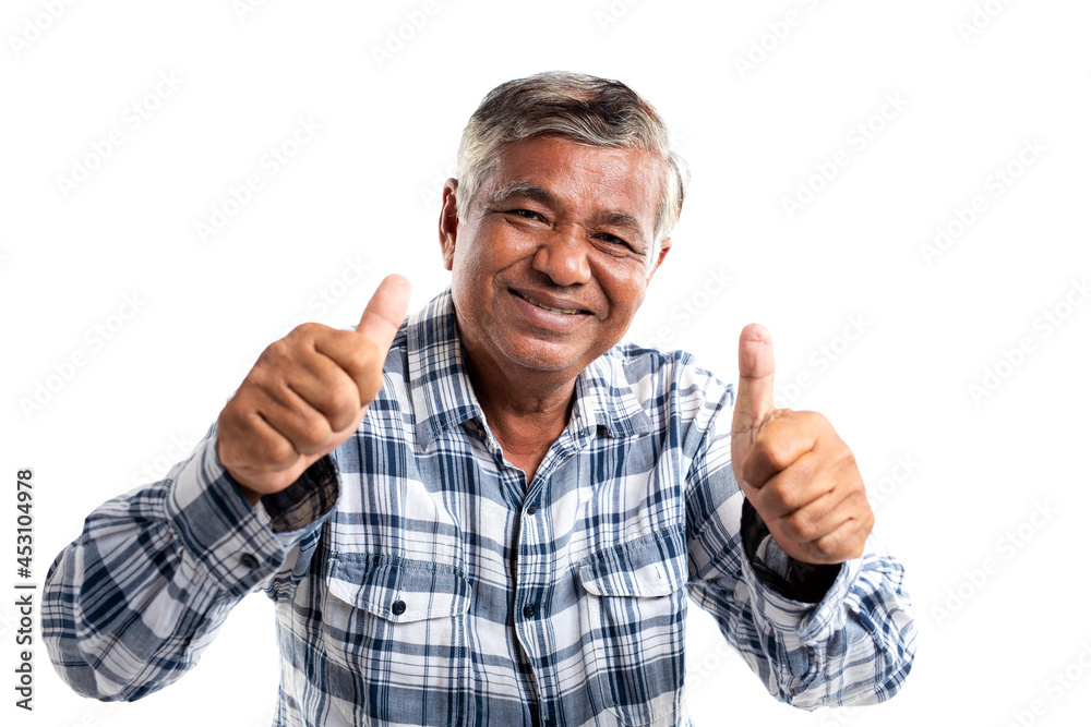 Portrait of an elderly man smiling and thumbs up looking at camera, isolated on white background. Portrait of an elderly man smiling and thumbs up looking at camera, isolated on white background.