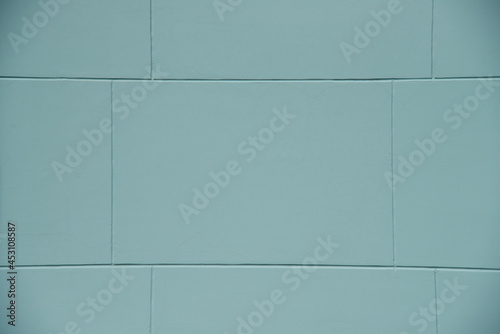 Pastel Blue brick wall texture background. Brickwork painted of blue color interior pattern clean concrete grid uneven brick design stack. Home or office design backdrop decoration.