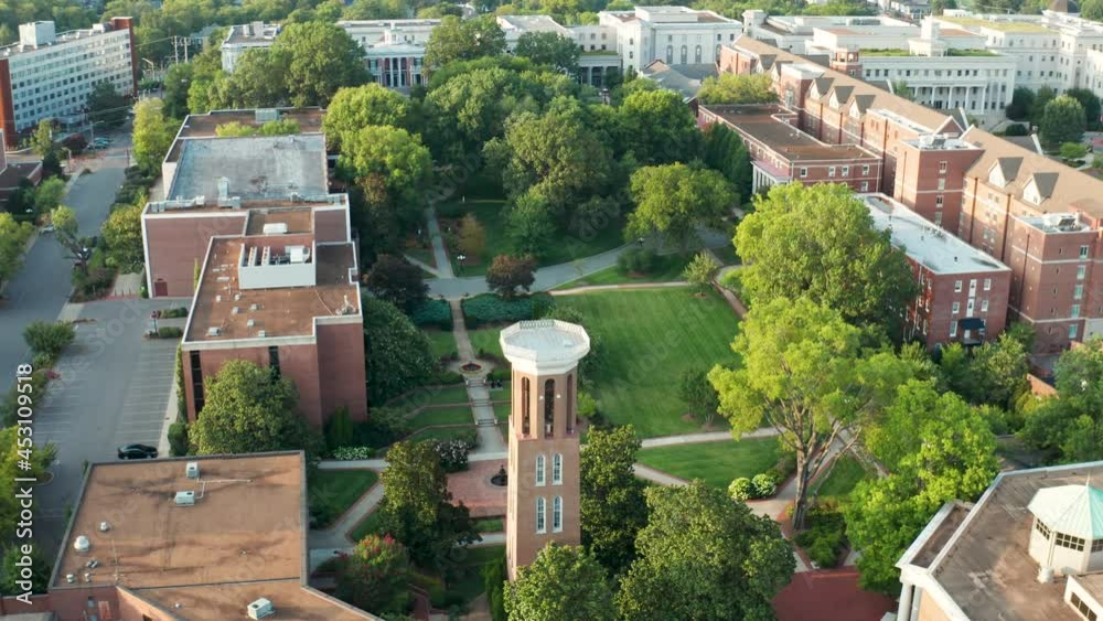 Belmont University college campus grounds. Bell tower, mansion, tilt up to reveal Nashville skyline. Aerial drone shot.