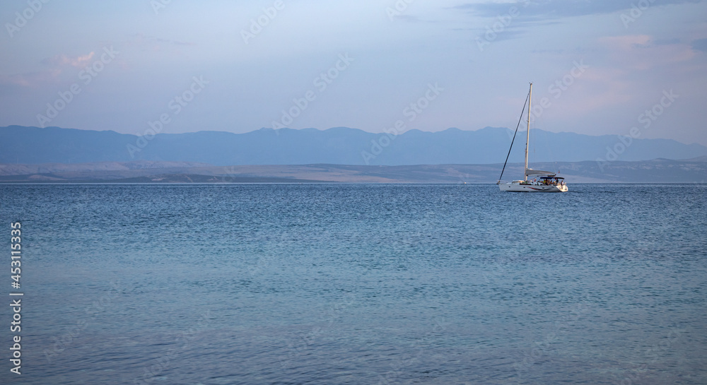Adriatic coast in the evening. The coastline and water are visible. Adriatic coast in the evening. The coastline and water are visible.