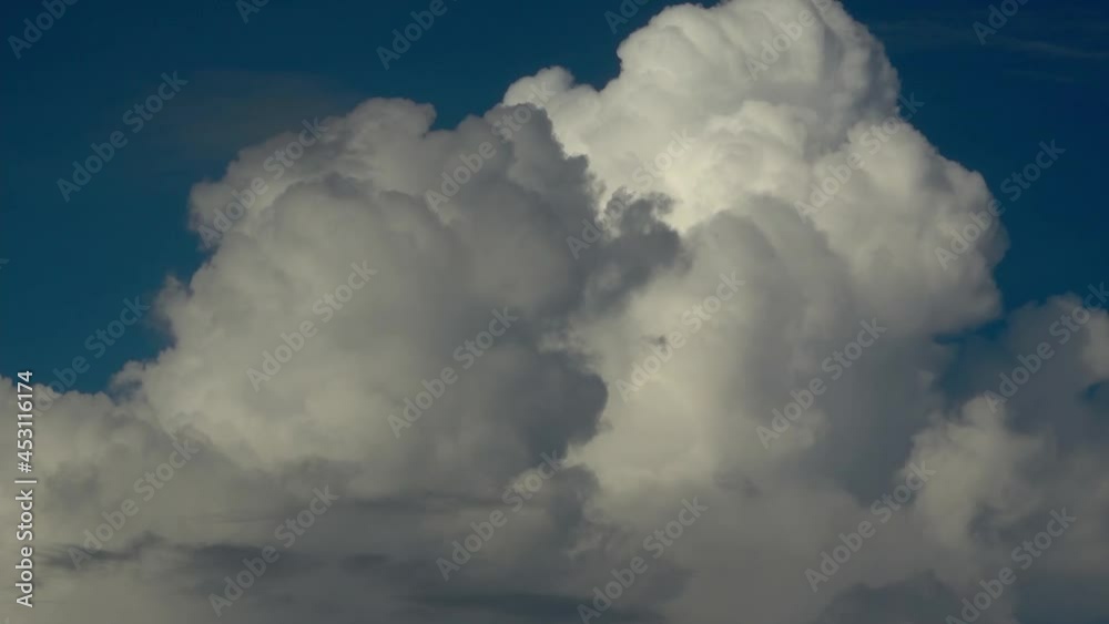 Large white fluffy clouds building - filmed in real-time at 60fps - Cumulosnimbus forming over the Philippines Large white fluffy clouds building - filmed in real-time at 60fps - Cumulosnimbus forming over the Philippines
