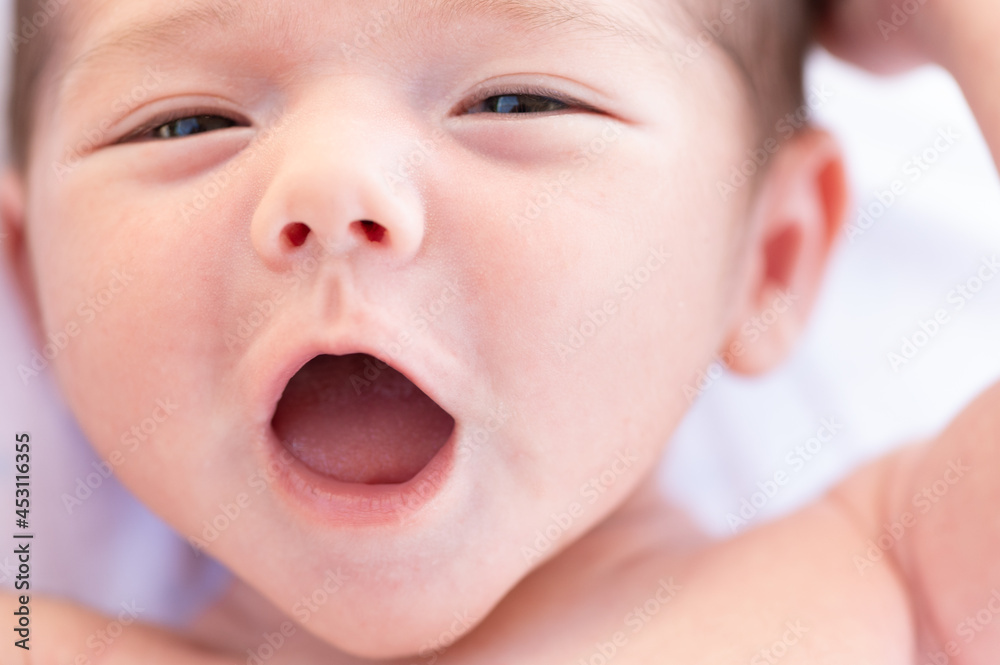 Cute newborn lying on bed Cute newborn lying on bed