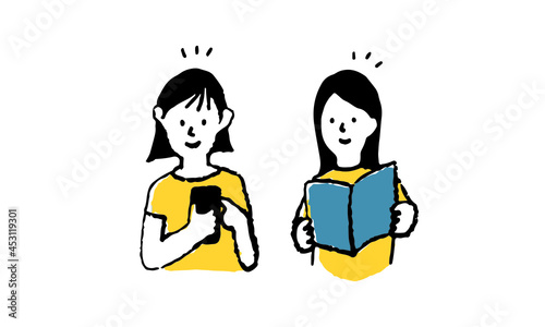 スマートフォンとガイドブックで調べ物をする二人の女の子