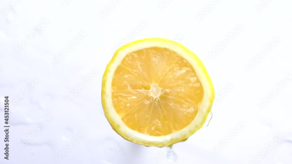 Fresh cutted yellow lemons and Rotating on table top down view Fresh cutted yellow lemons and Rotating on table top down view