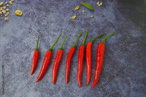 fresh chili peppers on black background,ripe red chili peppers