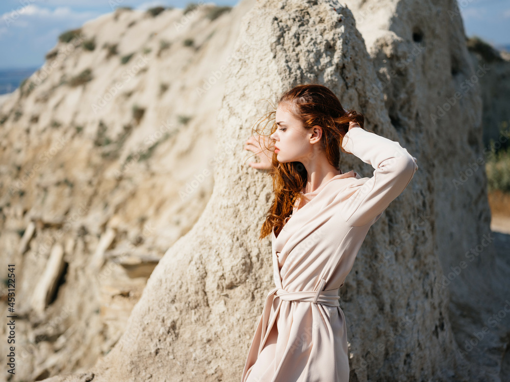 beautiful woman posing on the sand lifestyle fashion